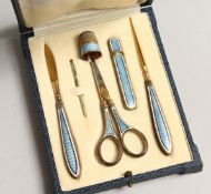 A SILVER AND ENAMEL TRAVELLING VANITY SET in a leather case 
