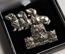 TWO SILVER DOG BRACELETS