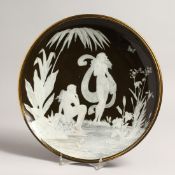 A GOOD PATE SUR PATE CIRCULAR DISH with classical figures in relief, beside a pool. 12ins diameter