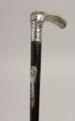 A WALKING CANE with .800silver handle encscribed 