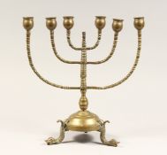 AN ANTIQUE JEWISH BRASS MENORAH 13ins high
