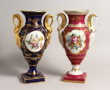 TWO 19TH CENTURY LIMOGES BLUE GROUND PORCELAIN TWO HANDLED VASES, painted with reverse panels of