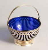 A TIFFANY & CO. PIERCED SILVER SUGAR BOWL with sapphire blue liner