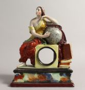 A PRATTWARE CLOCK CASE, a classical female seated beside a globe. 9ins high.