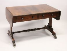 A GOOD REGENCY ROSEWOOD SOFA TABLE, with folding flaps, two single drawers with replacement wooden