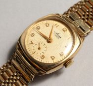 A 9CT GOLD 1930 - 1940 AVIA BALL BACK WATCH. CUSTODIAN BRACELET