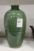 A Chinese green glazed bottle vase.