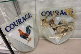 A pair of Courage Brewery shield shaped glass signs painted with the Courage cockerel.