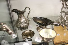 Plated items to include a Christofle sauce boat with ladle, an embossed jug, a wine taster and a