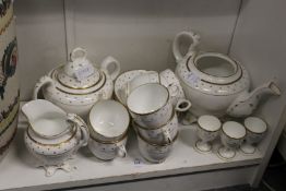 A gilt decorated part tea service.