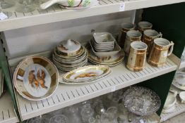 A group of continental porcelain china decorated with lobsters together with a similar set of six