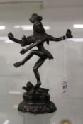 An eastern bronze multi-armed standing deity.
