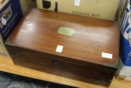 A 19th century mahogany and brass bound writing slope.