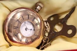 A gilt metal pocket watch and chain.