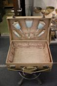 A ladies' leather travelling case, the lid opening to reveal a selection of silver and enamel