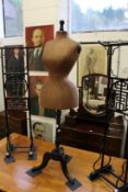 A 19th century dressmaker's dummy on ebonised stand, the body with wasp waste.