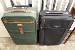 A Pierre Cardin suitcase together with a similar Samsonite suitcase.