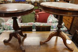 Two mahogany tripod tables.