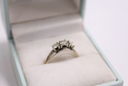A white gold and diamond three stone ring.