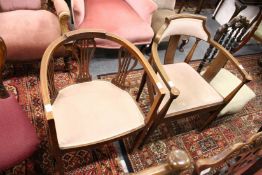 Two Edwardian mahogany horseshoe shaped armchairs.
