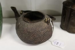 A Japanese cast metal teapot.