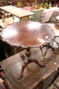 A George III design mahogany pie crust tripod table.