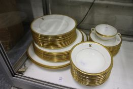 A Minton part dinner service, white porcelain ground, gilt decoration, initialled with the letter '