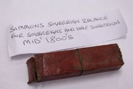 A boxed set of Simmons sovereign balances, for sovereigns and half sovereigns, circa 1850.
