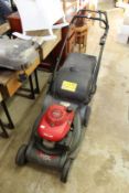A Honda HRX 476 petrol rotary lawnmower.