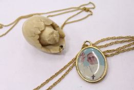 Two decorative pendants.