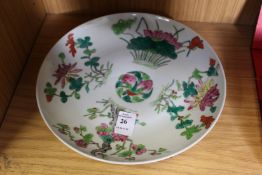 A Chinese circular dish painted with flowers, prunus tree etc.