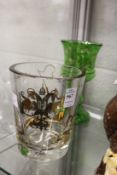 A gilt decorated glass vase or ice bucket, made by Culver, Brooklyn, New York and a green glass