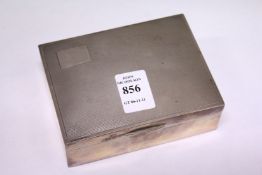 An engine turned silver cigarette box.