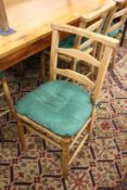 A set of eight beech framed rush seated dining chairs.