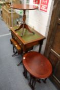 A small pedestal table, a miniature sofa table and a nest of tables.