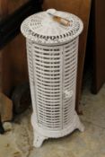 A white painted cast metal conservatory heater frame.