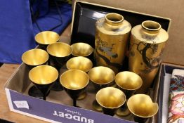 A pair of Japanese lacquer vases and stands and similar items.