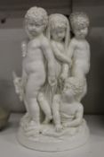 A 19th century white porcelain candelabra base modelled as children and a goat by a tree stump.