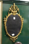 A gilt framed mirror.