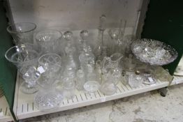 A quantity of cut glass and other items to include decanters, vases, knife rests etc.