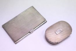 An engine turned silver snuff box and a plated calling card case.