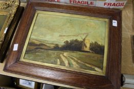 A rural scene with a windmill, oil on canvas, in an oak frame.
