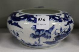 A small Chinese blue and white circular bowl.