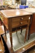 A 19th century mahogany two drawer drop flap work table.