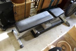 A weight lifting bench and a Reebok exercise step.