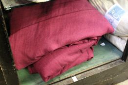 Dark red Hessian style curtains.