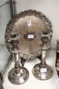 An Old Sheffield Plate pair of candlesticks and an ornate salver.