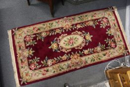 A red ground Chinese rug.