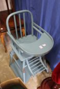 An old fashioned style high-chair.