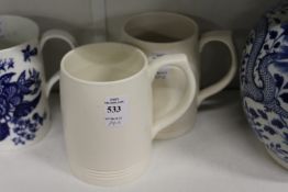 A pair of Keith Murray for Wedgwood pottery tankards.